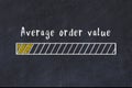 Chalk sketch of progress bar on black desk with small load. KPI evaluation concept