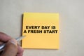 Concept of Every day is a fresh start write on sticky notes  on Wooden Table Royalty Free Stock Photo