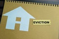 Concept of Eviction write on sticky notes isolated on Wooden Table Royalty Free Stock Photo