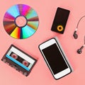 The concept of the evolution of music. Cassette, CD-disk, mp3 player, mobile phone Royalty Free Stock Photo