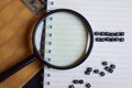 Concept of Expert Advice word on wooden cubes, on magnifying glass, books in background