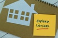 Concept of Expired Listings write on sticky notes isolated on Wooden Table