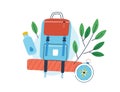 Concept of exploration, ecotourism and hiking. Composition of a backpack, bottle of water and compass decorated with