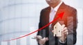 Concept of falling real estate market, down arrow and wooden house. The concept of falling property prices. Lower housing prices. Royalty Free Stock Photo