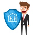 Concept of family insurance support service. Businessman holding shield symbol of protection with family in house icon.