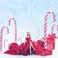 Christmas fantasy portrait of young woman with gift boxes Royalty Free Stock Photo