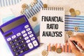 Concept of Financial Ratio Analysis write on sticky notes isolated on Wooden Table Royalty Free Stock Photo