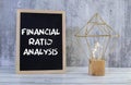 Concept of Financial Ratio Analysis write on sticky notes isolated on Wooden Table. Royalty Free Stock Photo