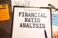 Concept of Financial Ratio Analysis write on sticky notes isolated on Wooden Table Royalty Free Stock Photo