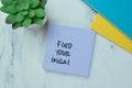 Concept of Find Your Ikigai write on sticky notes isolated on Wooden Table