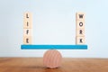 Concept of finding the right balance. Wooden cubes on seesaw Royalty Free Stock Photo