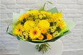 Beautiful bouquet of yellow flowers on a white background close