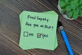 Concept of Food Safety. Are you at risk? Yes write on sticky notes isolated on Wooden Table Royalty Free Stock Photo