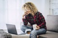 Concept of free and hapy people work with computer technology at home not office - cheerful caucasian woman with laptop sit down Royalty Free Stock Photo