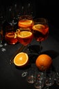 Concept of fresh summer cocktail, Aperol Spritz on wooden table against dark background Royalty Free Stock Photo
