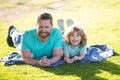 Concept of friendly family. Happy father and son enjoying summer time on vacation in a sunny park. Family camp, vacation Royalty Free Stock Photo