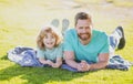 Concept of friendly family. Happy father and son enjoying summer time on vacation in a sunny park. Family camp Royalty Free Stock Photo