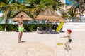 Oudoor summer activity. Concept of fun, health and vacation. A happy father and boy plaing with inflatable ring on white