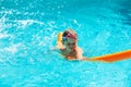 Oudoor summer activity. Concept of fun, health, vacation. Happy smiling boy five years old in swimming goggles laught Royalty Free Stock Photo