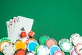 Concept of gambling in casino, sports poker. Game cards with dice and colored chips sleep green game table. Copy space for text. Royalty Free Stock Photo