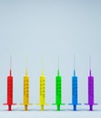 Concept on gay pride day, LGBTIQ PRIDE with colored medical syringes on light background. pride day, free love, gay day, lesbian