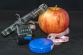 Concept - Getting in Shape. Closeup on Measuring Tape and Apple