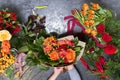 The concept of gifts and bouquets for March 8 and Mother`s Day. Florist creates a bouquet in a flower shop Royalty Free Stock Photo