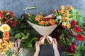 The concept of gifts and bouquets for March 8 and Mother`s Day. Florist creates a bouquet in a flower shop. Top view of Royalty Free Stock Photo