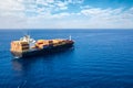 A container cargo ship traveling on the open sea