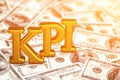 Concept gold abbreviation of KPI - Key Perfomance Indicator standing or lying on banknotes background. 3D Render. Royalty Free Stock Photo