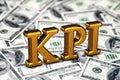 Concept gold abbreviation of KPI - Key Perfomance Indicator standing or lying on banknotes background. 3D Render.