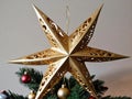 A Gold Star Orname On A Christmas Tree. Generative AI