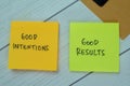 Concept of Good Intentions and Good Results write on sticky notes isolated on Wooden Table