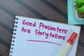 Concept of Good Presenters Are Storytellers write on book isolated on Wooden Table