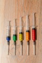 Concept graphics of virus infection from multi-colored syringes. Graphics of the virus epidemic COVID Royalty Free Stock Photo