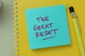 Concept of The Great Reset write on sticky notes isolated on Wooden Table Royalty Free Stock Photo
