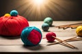 A group of balls of yarn and knitting needles on a table with yarn balls and needles in the middle of the image and a ball of yarn