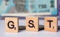 Concept of GST with indian currency on isolated background Royalty Free Stock Photo