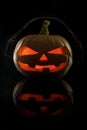 The concept of Halloween. Evil scary pumpkin in the dark in head Royalty Free Stock Photo