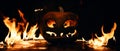 The concept of Halloween. The evil terrible pumpkin is burning i