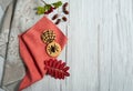 Homemade cookies with chocolate spiders, hawthorn berries, Rowan leaves, acorns, two linen napkins on a light wooden background. Royalty Free Stock Photo