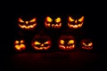 The concept of Halloween. A lot of Evil scary pumpkin in the dar Royalty Free Stock Photo