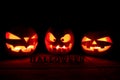 The concept of Halloween. A lot of Evil scary pumpkin in the dar Royalty Free Stock Photo