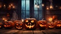 The concept of Halloween. Many glowing fiery light angry scary pumpkins. jack lantern in the dark, on a wooden background