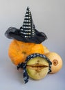 The Concept Of Halloween. Orange Pumpkin In A Witch& X27;s Hat, Pumpkin And Turnip In A Pirate Bandana