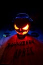 The concept of Halloween. Pumpkin jack Lamp, in headphones with Royalty Free Stock Photo
