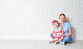 Concept happy family mother and baby daughter, girl at blank br Royalty Free Stock Photo