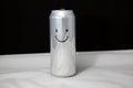 The concept of a happy look but empty in the soul of man. Smile emoticon on aluminium can, Emoji with laugh