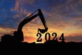 Concept happy new year 2024,crawler excavator silhouette