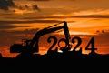 Concept happy new year 2024,crawler excavator silhouette